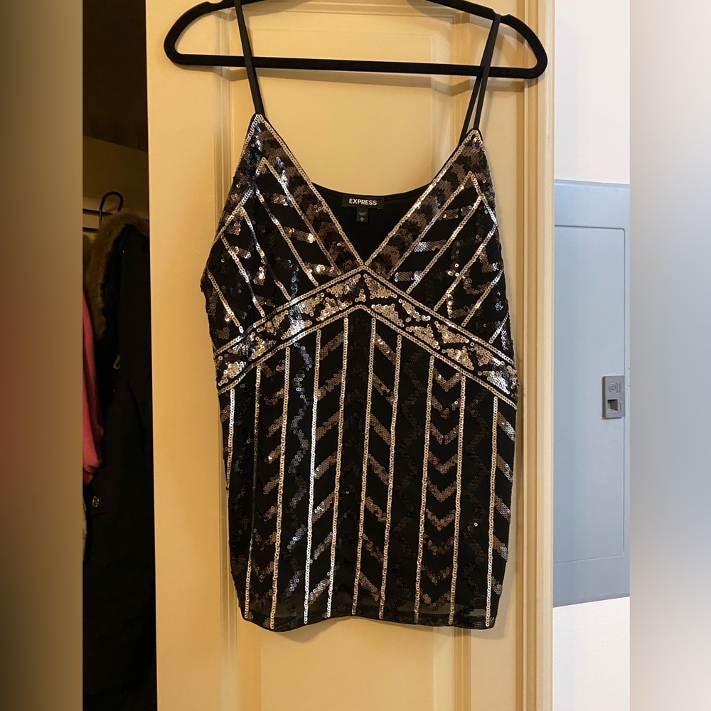 Express sequin tank. Has small hole on back that can be sewn.